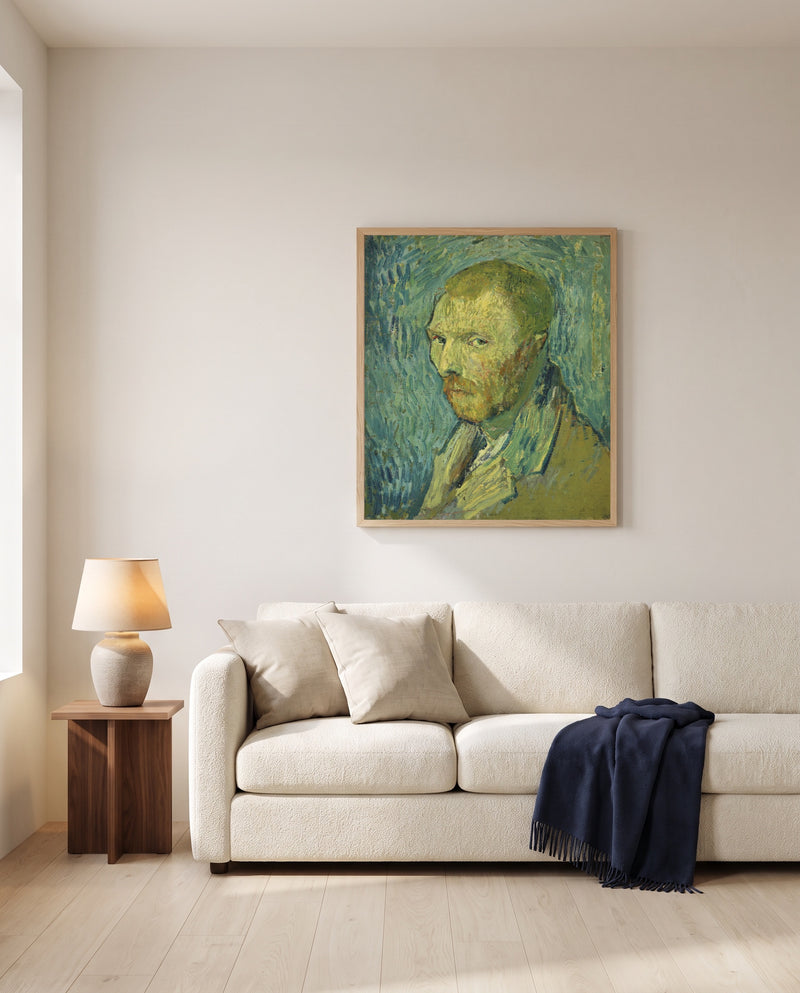 Self-Portrait, Oslo by Vincent van Gogh framed in natural oak above a cream sofa in a warm living room