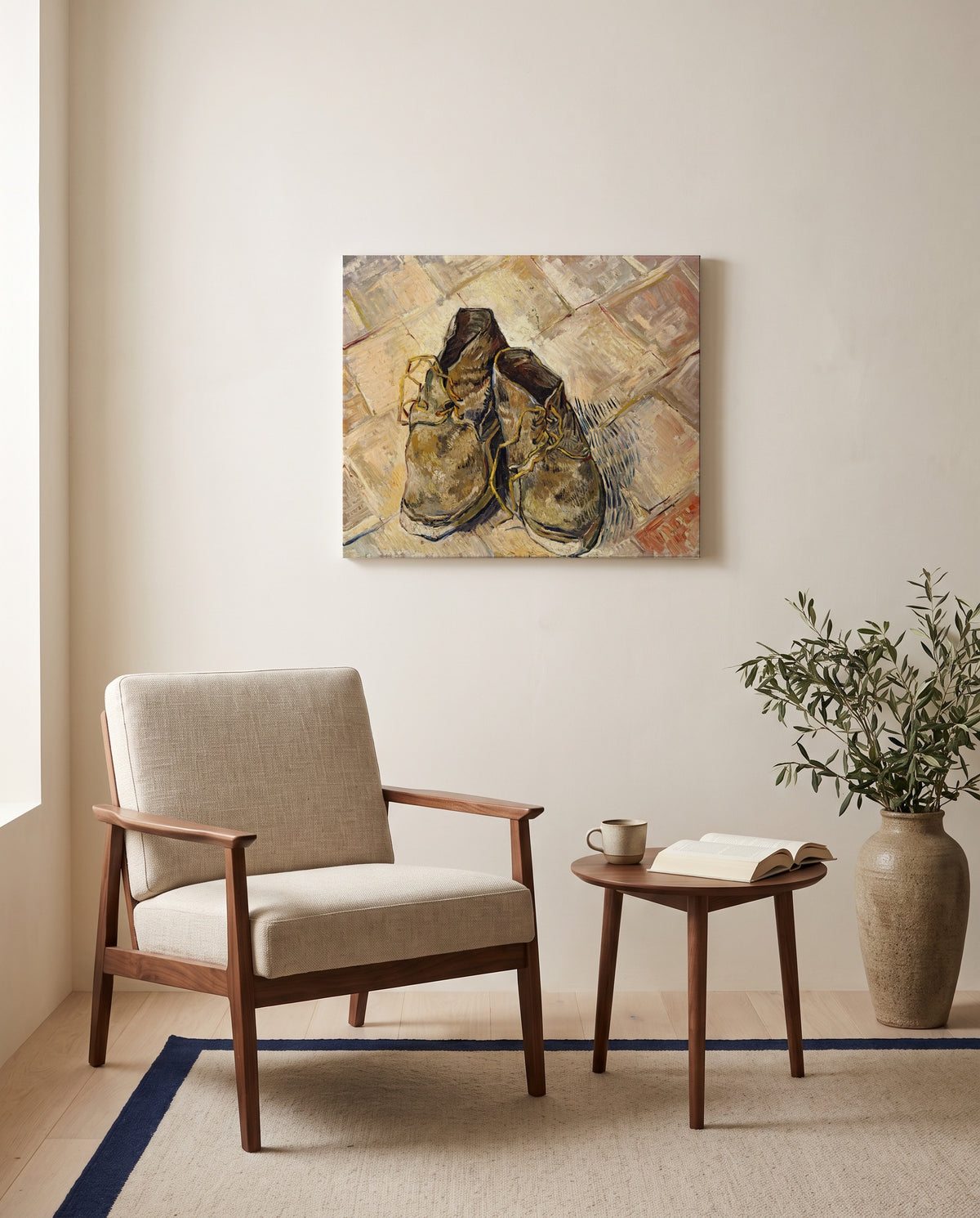 Shoes (1888) by Vincent van Gogh as a stretched canvas above a linen lounge chair in a reading corner