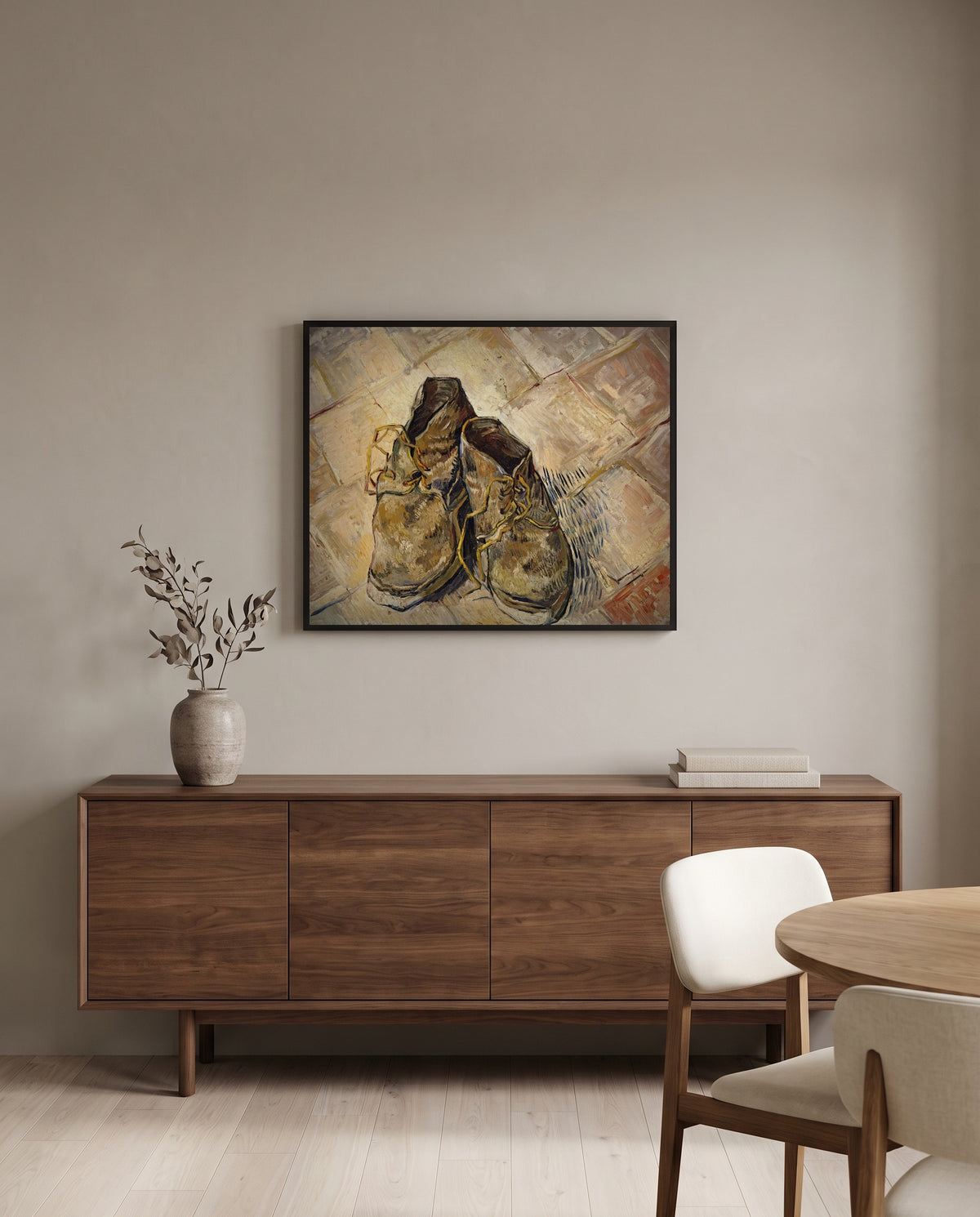Shoes (1888) by Vincent van Gogh in a black frame above a walnut sideboard in a dining room