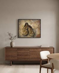 Shoes (1888) by Vincent van Gogh in a black frame above a walnut sideboard in a dining room