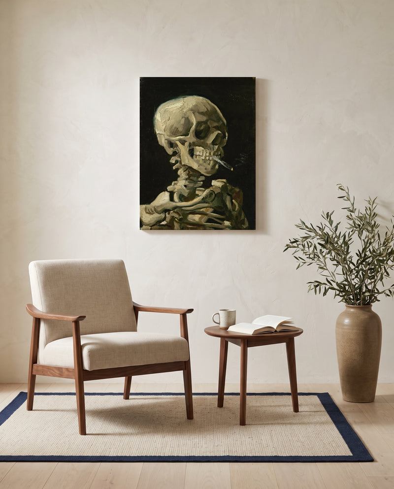 Skull with Burning Cigarette by Vincent van Gogh as a stretched canvas above a linen lounge chair in a reading corner
