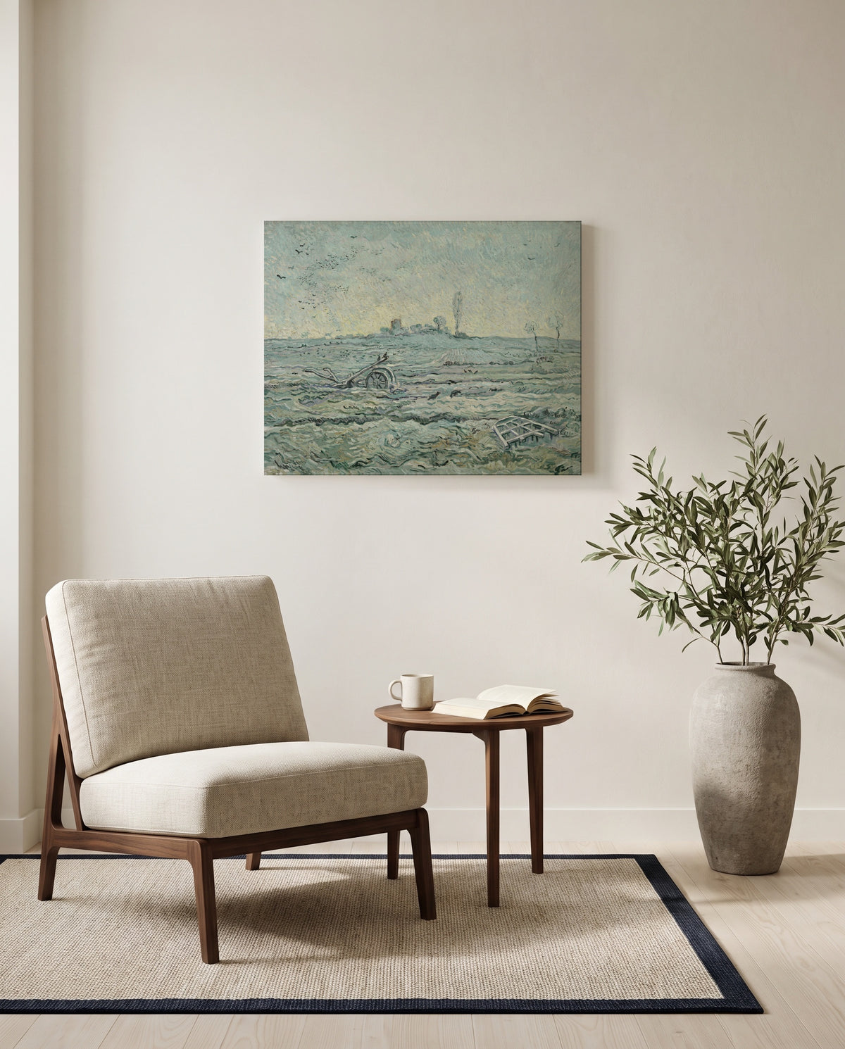 Snow-Covered Field with a Harrow by Vincent van Gogh as a stretched canvas above a linen lounge chair in a reading corner