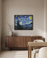 The Starry Night by Vincent van Gogh in a black frame above a walnut sideboard in a dining room