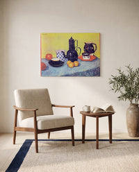 Still Life with Coffee Pot by Vincent van Gogh as a stretched canvas above a linen lounge chair in a reading corner