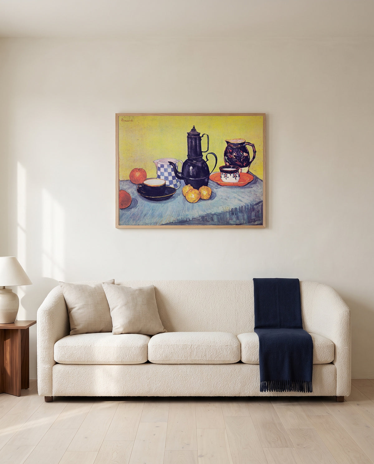 Still Life with Coffee Pot by Vincent van Gogh framed in natural oak above a cream sofa in a warm living room