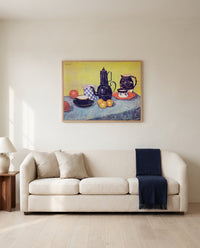 Still Life with Coffee Pot by Vincent van Gogh framed in natural oak above a cream sofa in a warm living room