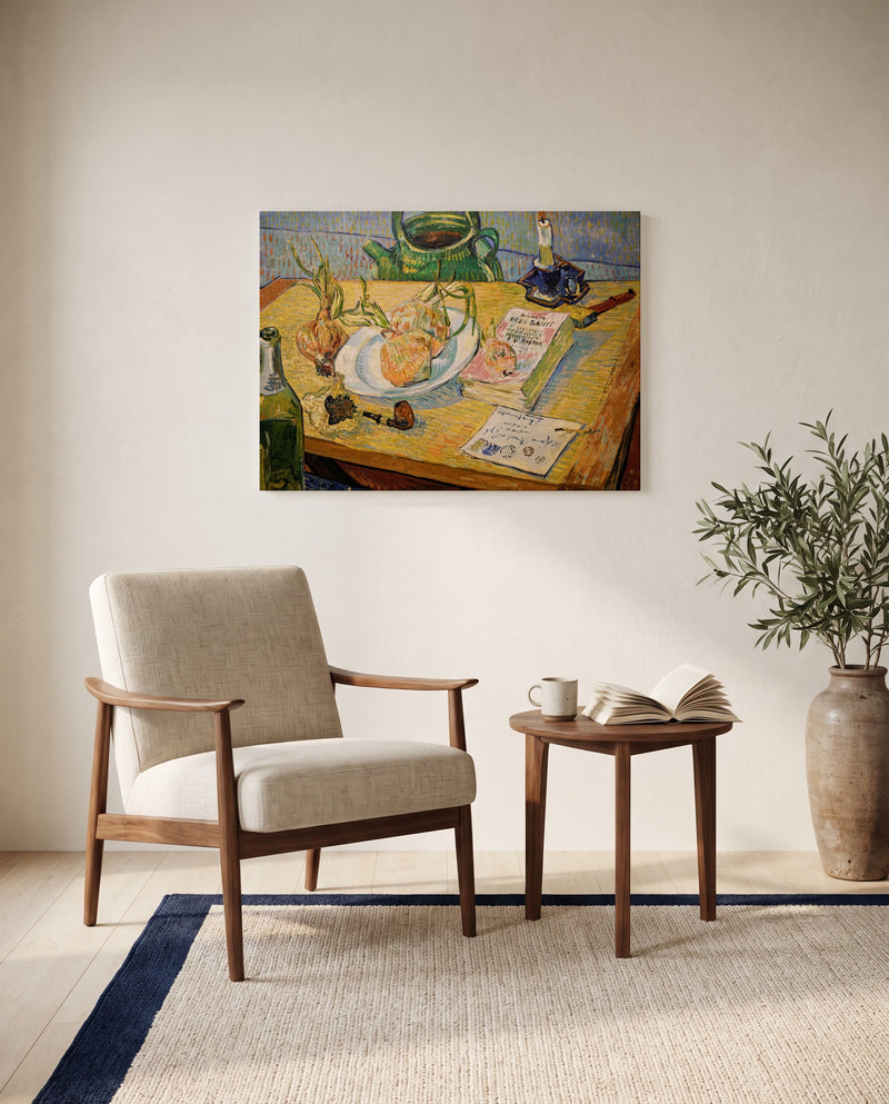 Still Life with Onions by Vincent van Gogh as a stretched canvas above a linen lounge chair in a reading corner