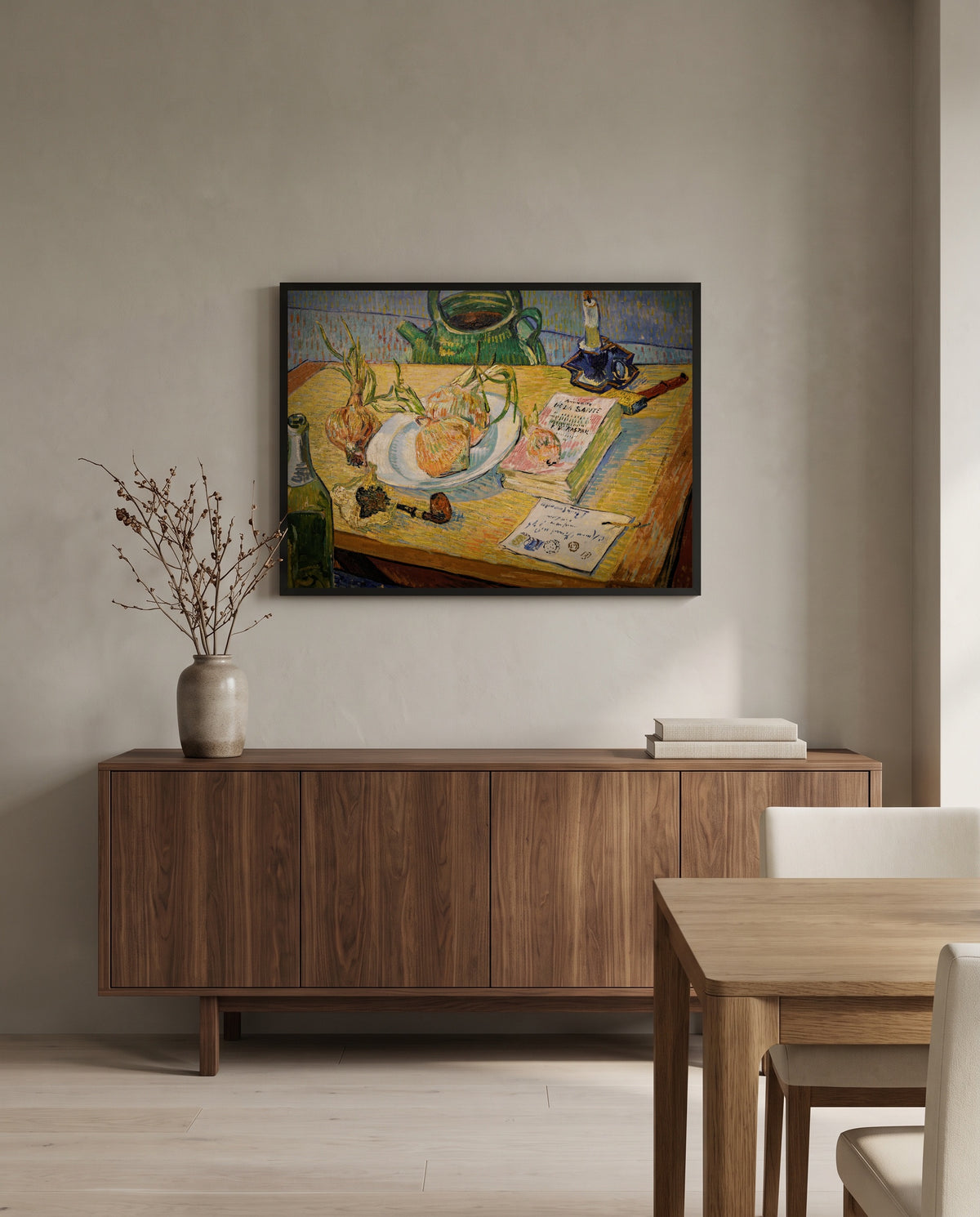 Still Life with Onions by Vincent van Gogh in a black frame above a walnut sideboard in a dining room