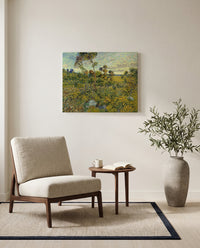 Sunset at Montmajour by Vincent van Gogh as a stretched canvas above a linen lounge chair in a reading corner