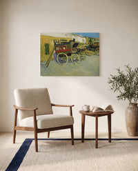 The Tarascon Diligence by Vincent van Gogh as a stretched canvas above a linen lounge chair in a reading corner