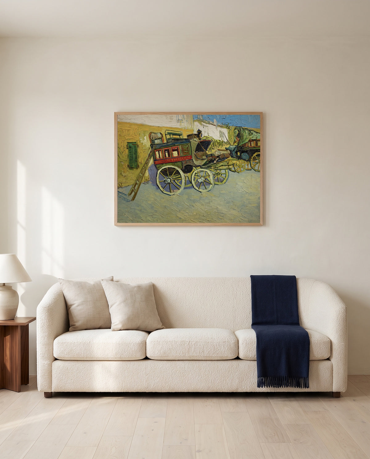 The Tarascon Diligence by Vincent van Gogh framed in natural oak above a cream sofa in a warm living room