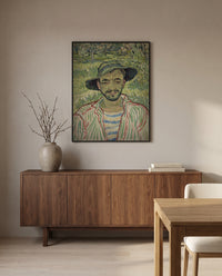 The Gardener by Vincent van Gogh in a black frame above a walnut sideboard in a dining room