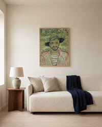 The Gardener by Vincent van Gogh framed in natural oak above a cream sofa in a warm living room