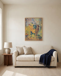 The Good Samaritan by Vincent van Gogh framed in natural oak above a cream sofa in a warm living room