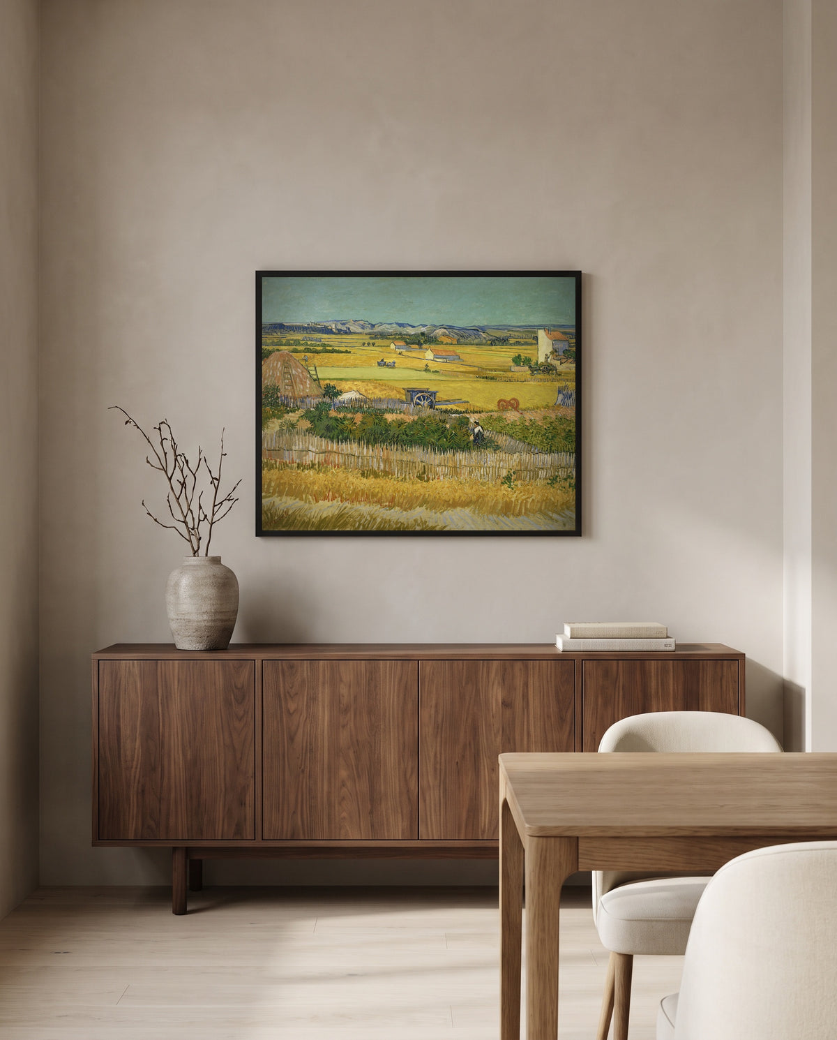 The Harvest by Vincent van Gogh in a black frame above a walnut sideboard in a dining room