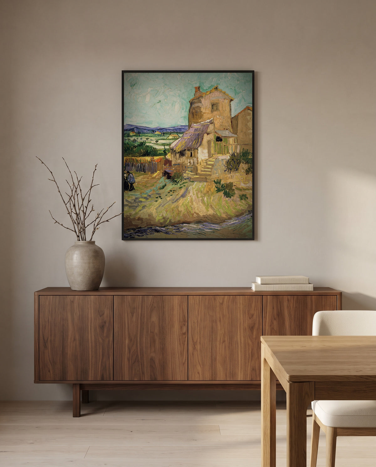 The Old Mill by Vincent van Gogh in a black frame above a walnut sideboard in a dining room