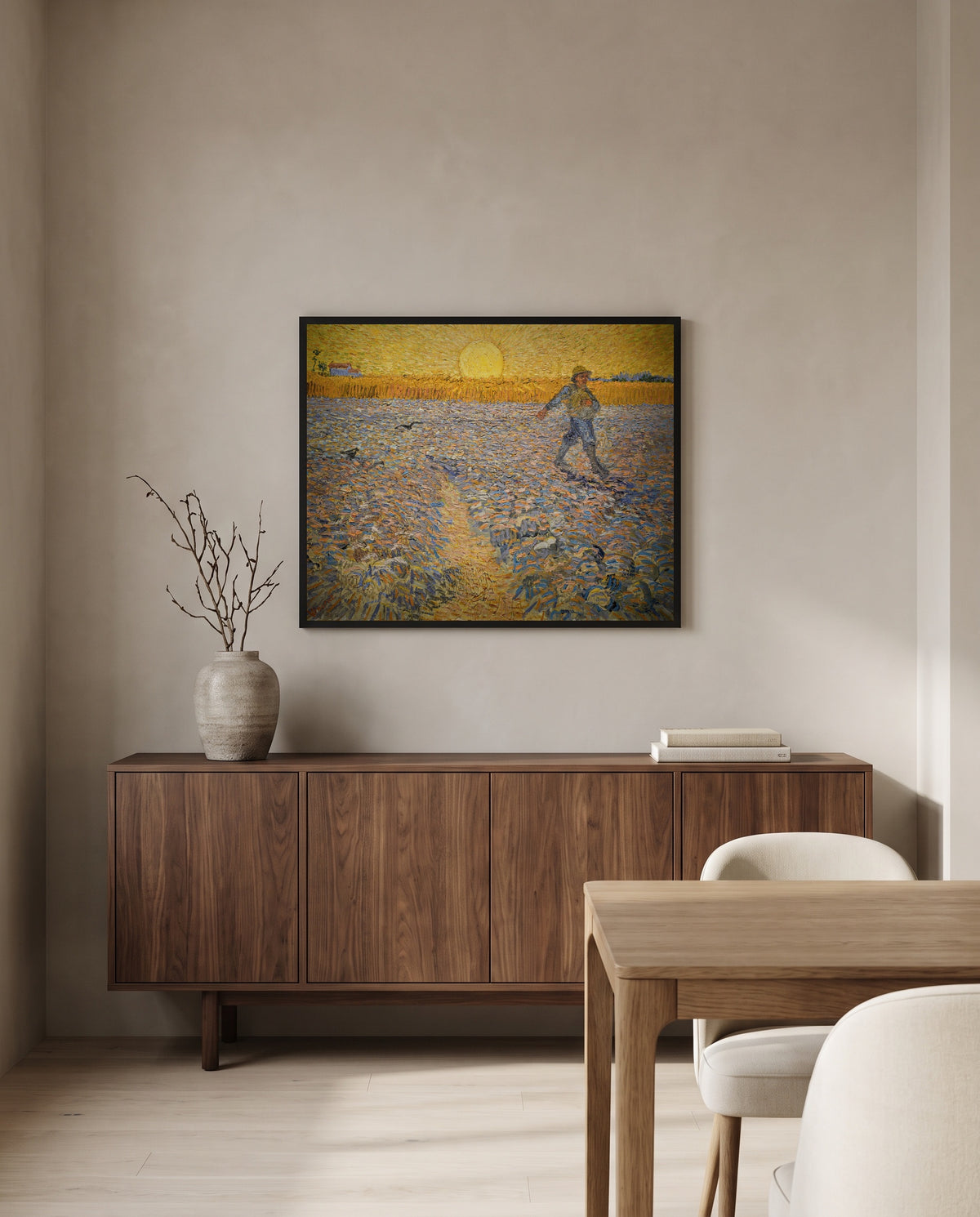 The Sower by Vincent van Gogh in a black frame above a walnut sideboard in a dining room