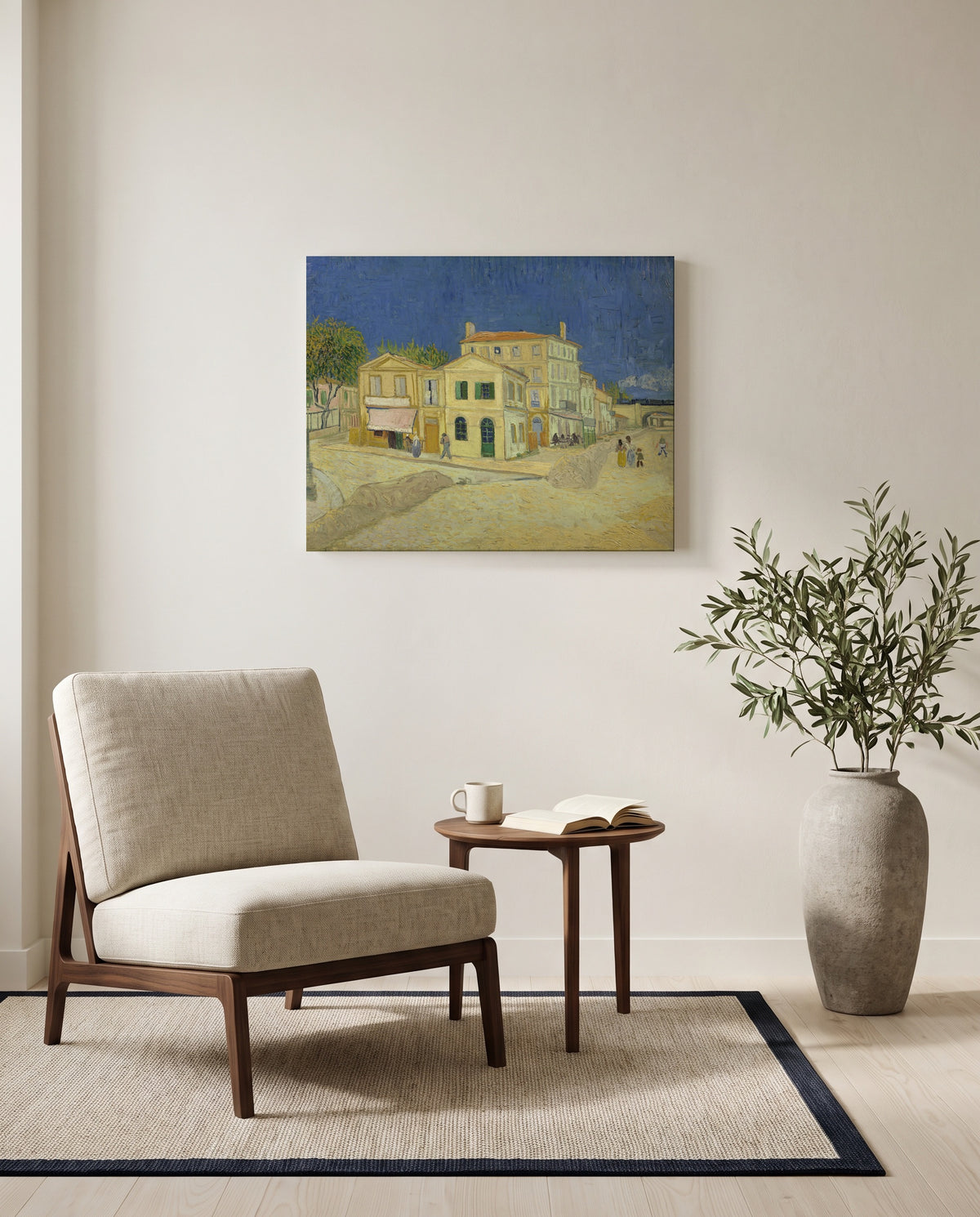 The Yellow House by Vincent van Gogh as a stretched canvas above a linen lounge chair in a reading corner