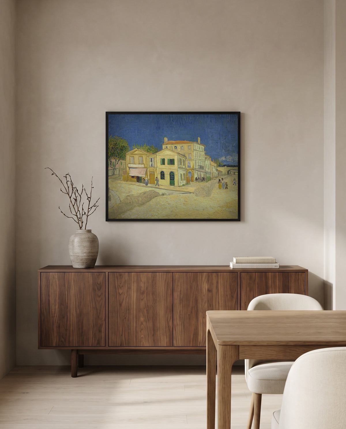 The Yellow House by Vincent van Gogh in a black frame above a walnut sideboard in a dining room