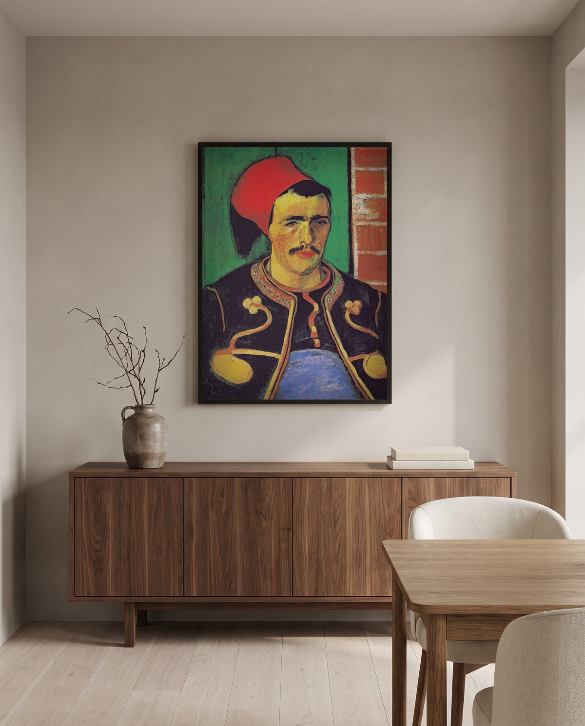 The Zouave by Vincent van Gogh in a black frame above a walnut sideboard in a dining room