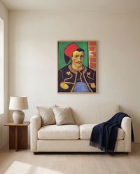 The Zouave by Vincent van Gogh framed in natural oak above a cream sofa in a warm living room
