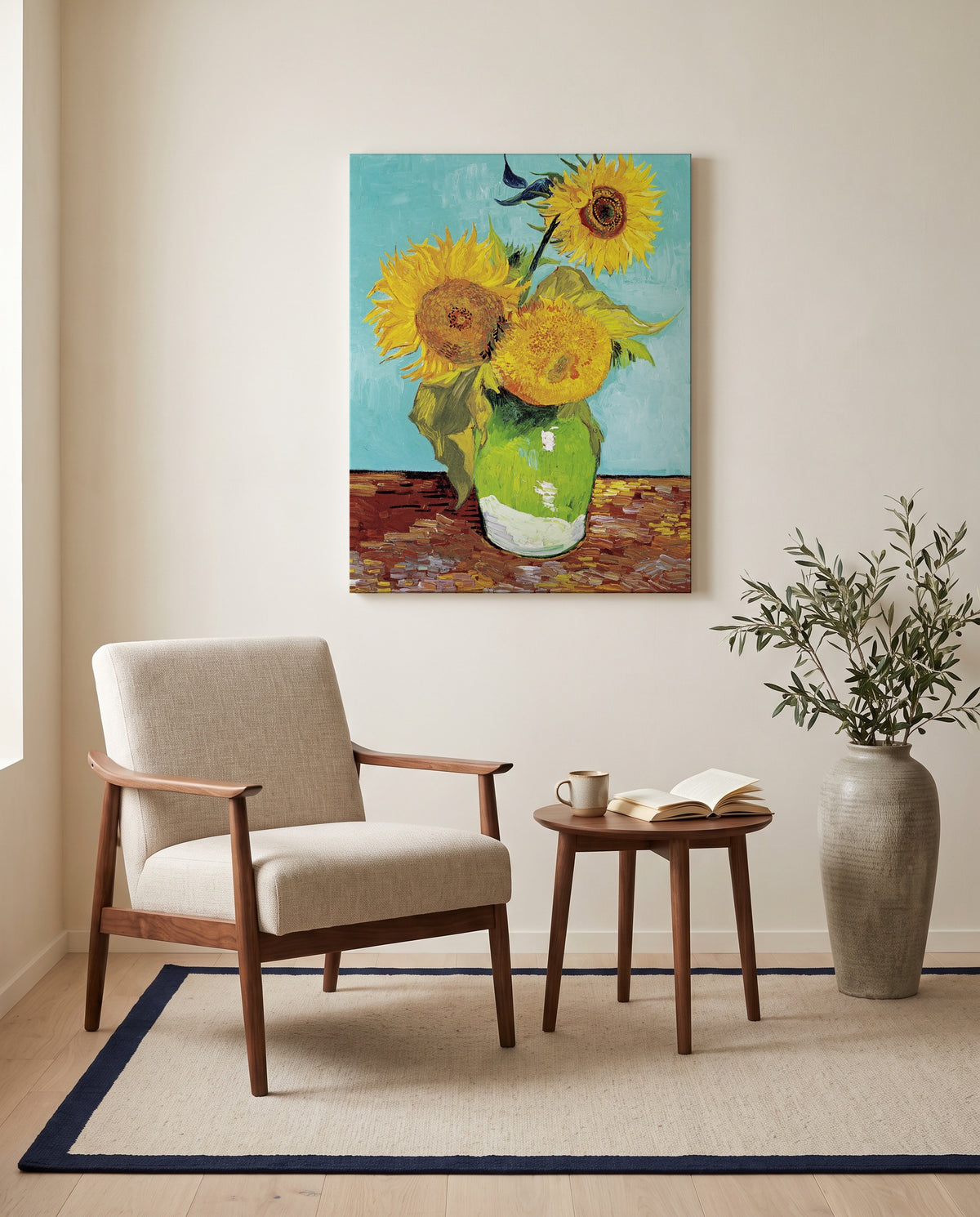 Three Sunflowers in a Vase by Vincent van Gogh as a stretched canvas above a linen lounge chair in a reading corner