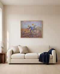 Two Peasants Digging by Vincent van Gogh framed in natural oak above a cream sofa in a warm living room