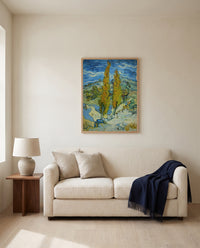 Two Poplars in the Alpilles by Vincent van Gogh framed in natural oak above a cream sofa in a warm living room