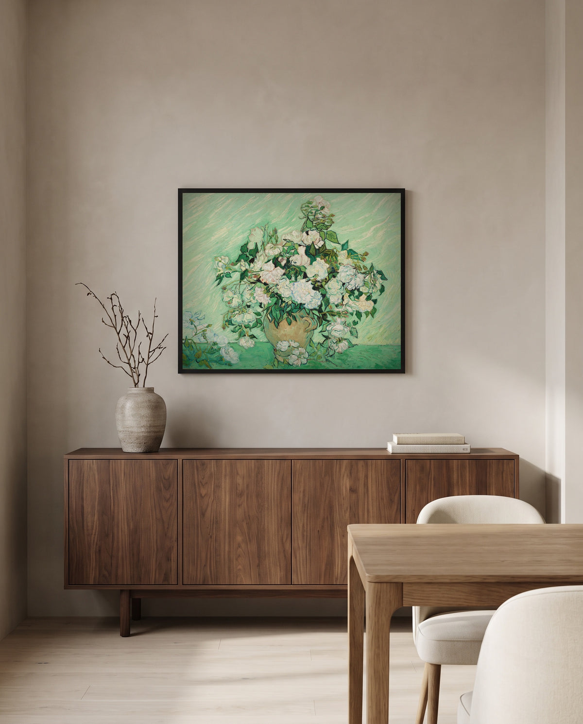 Vase with Pink Roses by Vincent van Gogh in a black frame above a walnut sideboard in a dining room