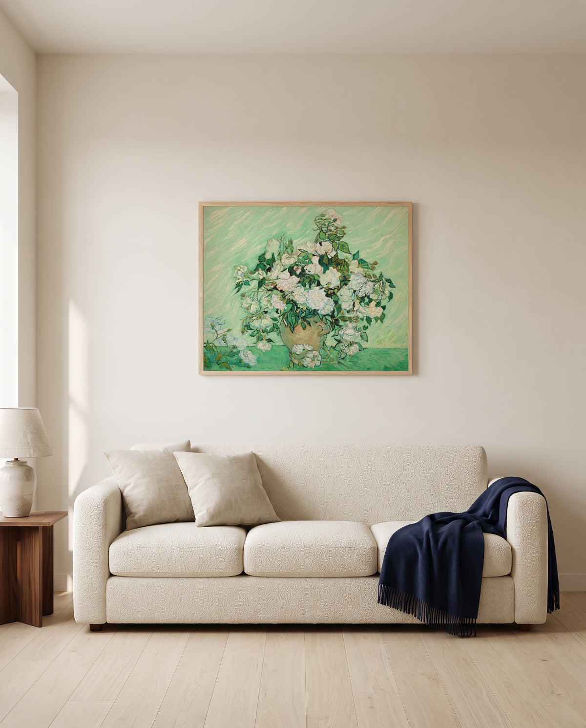 Vase with Pink Roses by Vincent van Gogh framed in natural oak above a cream sofa in a warm living room