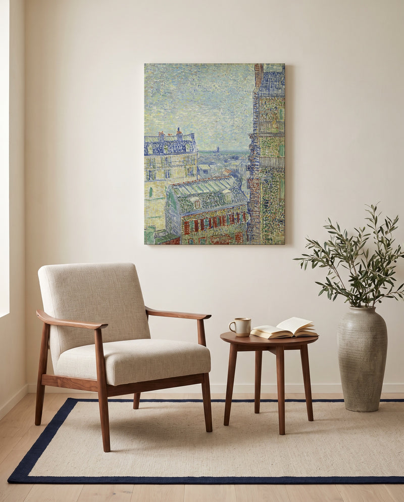 View from Theo’s Apartment by Vincent van Gogh as a stretched canvas above a linen lounge chair in a reading corner