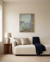 View from Theo’s Apartment by Vincent van Gogh framed in natural oak above a cream sofa in a warm living room