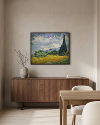Wheat Field with Cypresses by Vincent van Gogh in a black frame above a walnut sideboard in a dining room