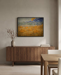 Wheat Sheaves and Rising Moon by Vincent van Gogh in a black frame above a walnut sideboard in a dining room