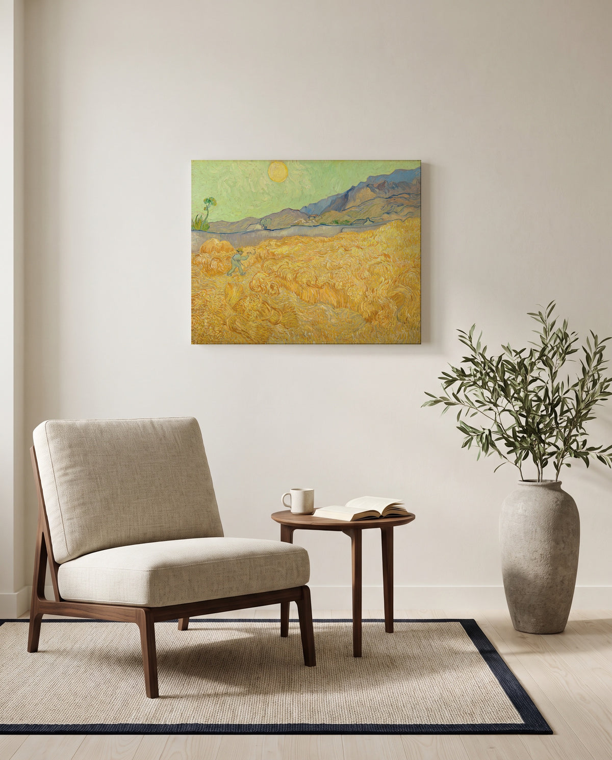 Wheatfield with a Reaper by Vincent van Gogh as a stretched canvas above a linen lounge chair in a reading corner