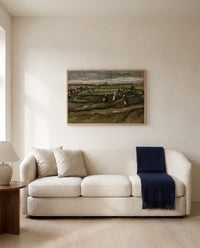 Women Mending Nets in the Dunes by Vincent van Gogh framed in natural oak above a cream sofa in a warm living room