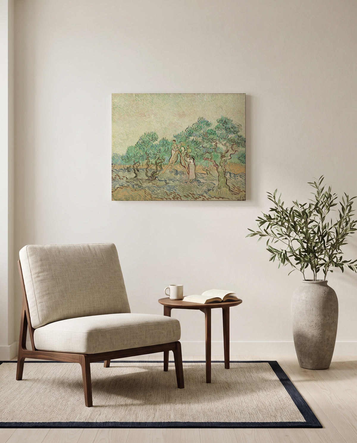 Women Picking Olives by Vincent van Gogh as a stretched canvas above a linen lounge chair in a reading corner