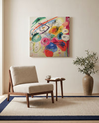 Black Lines by Wassily Kandinsky as a stretched canvas above a linen lounge chair in a reading corner