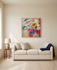 Black Lines by Wassily Kandinsky framed in natural oak above a cream sofa in a warm living room