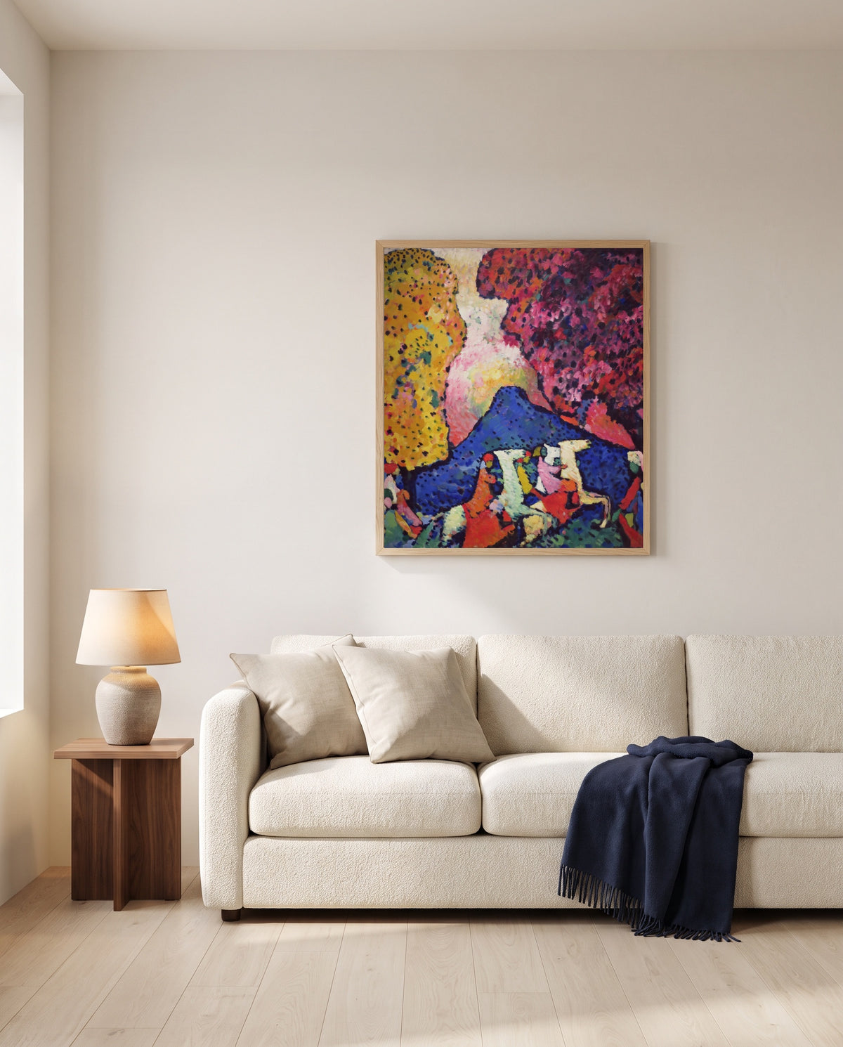 Blue Mountain by Wassily Kandinsky framed in natural oak above a cream sofa in a warm living room