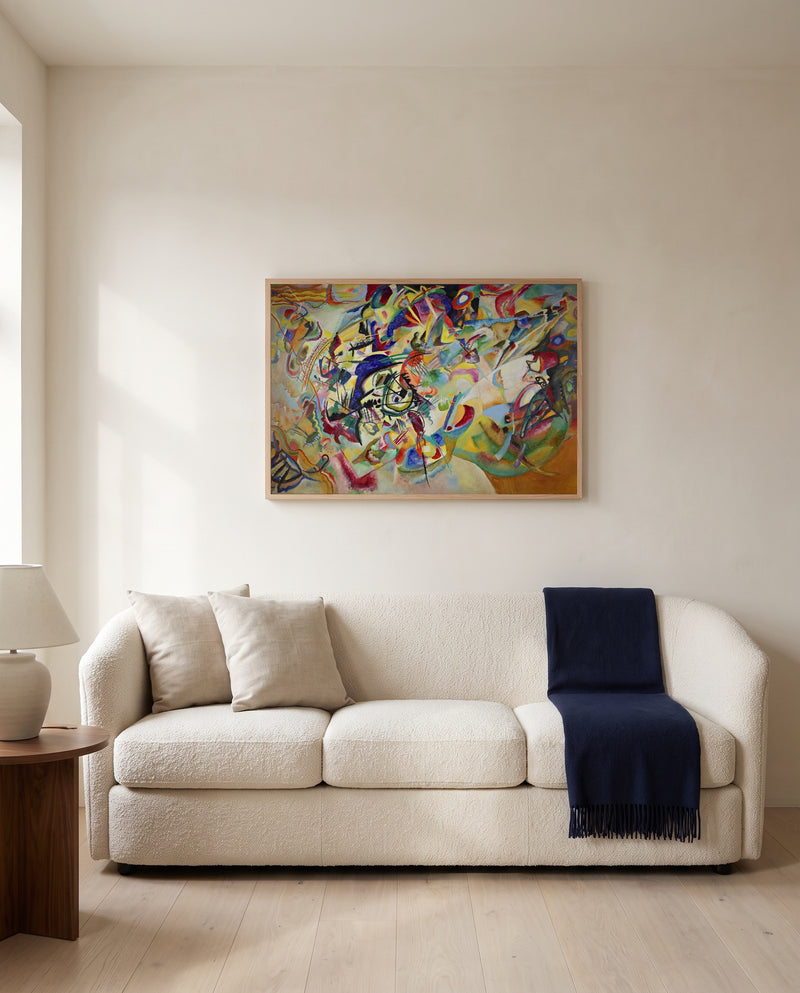 Composition VII by Wassily Kandinsky framed in natural oak above a cream sofa in a warm living room