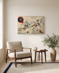 Composition VIII by Wassily Kandinsky as a stretched canvas above a linen lounge chair in a reading corner