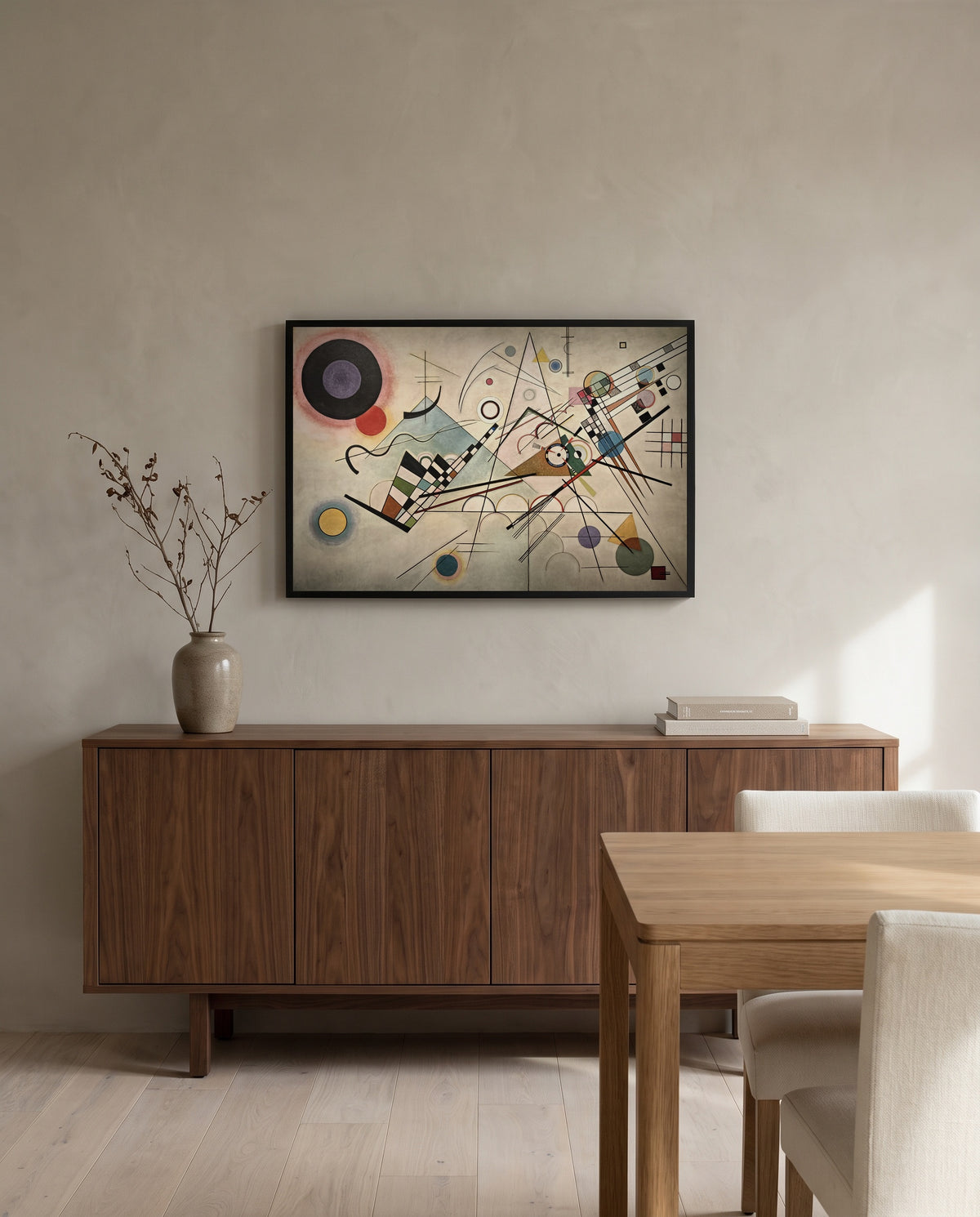 Composition VIII by Wassily Kandinsky in a black frame above a walnut sideboard in a dining room