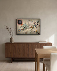 Composition VIII by Wassily Kandinsky in a black frame above a walnut sideboard in a dining room