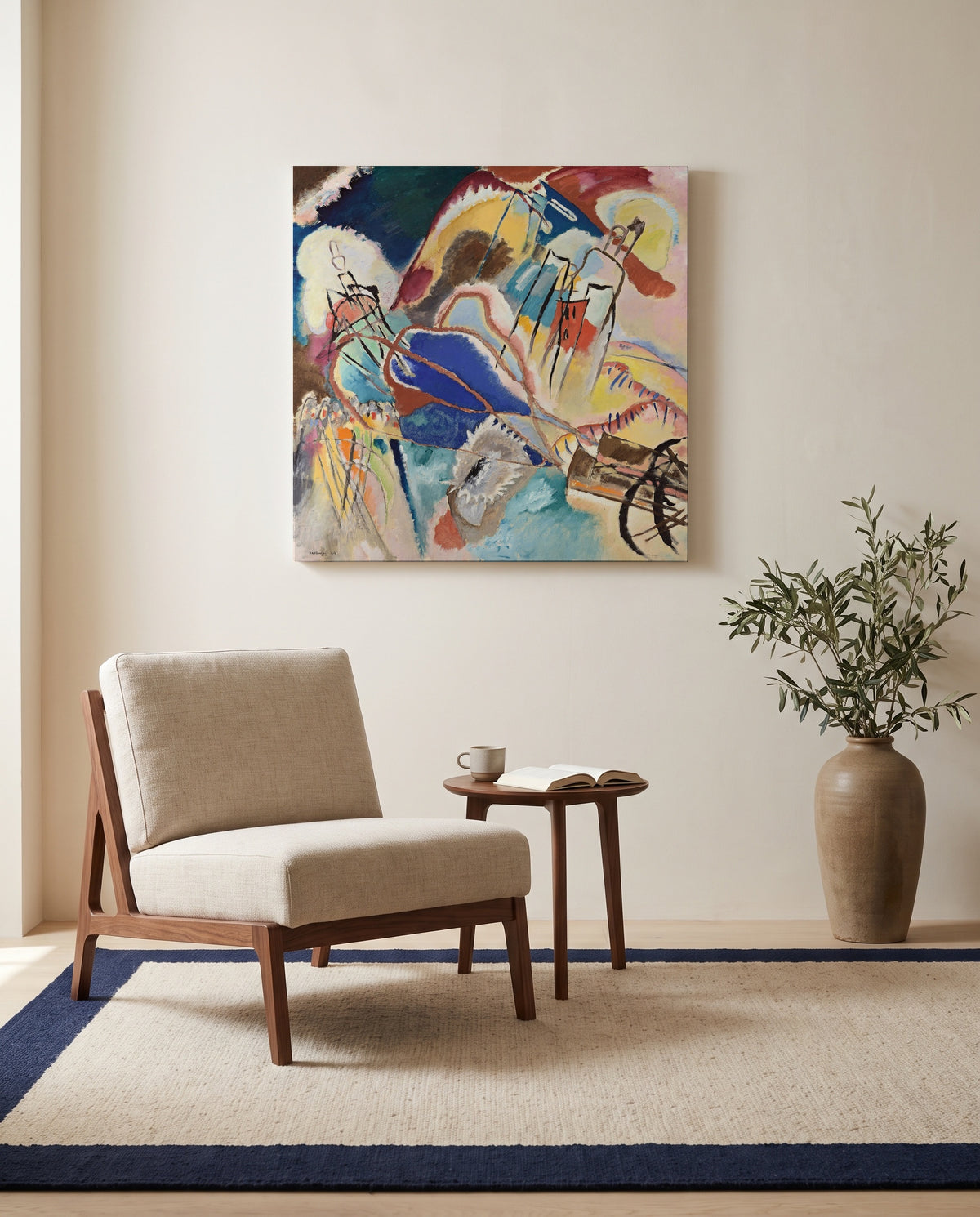 Improvisation No. 30 (Cannons) by Wassily Kandinsky as a stretched canvas above a linen lounge chair in a reading corner
