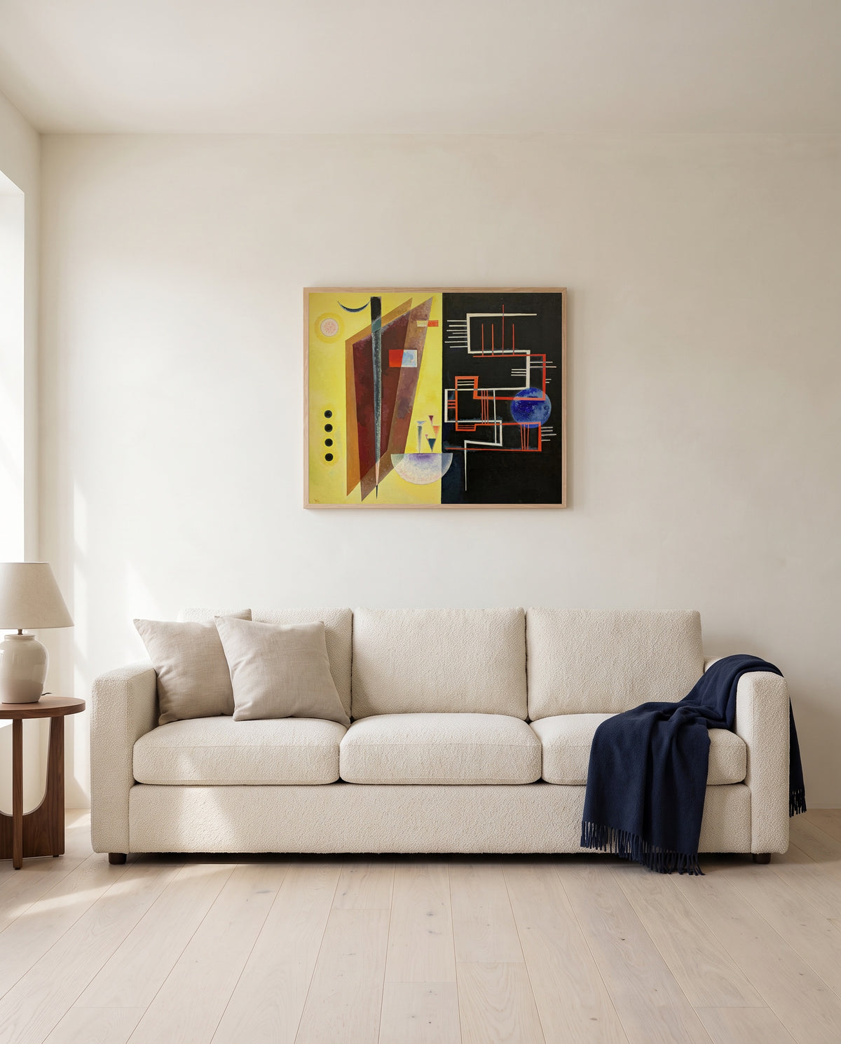 Inner Alliance by Wassily Kandinsky framed in natural oak above a cream sofa in a warm living room