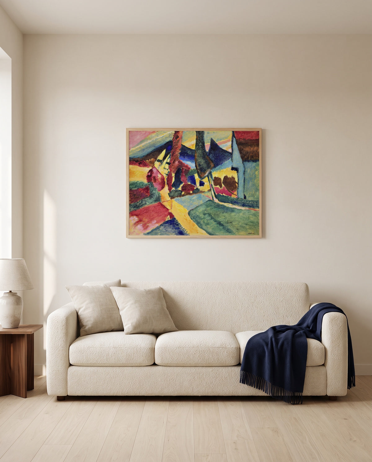 Landscape with Two Poplars by Wassily Kandinsky framed in natural oak above a cream sofa in a warm living room
