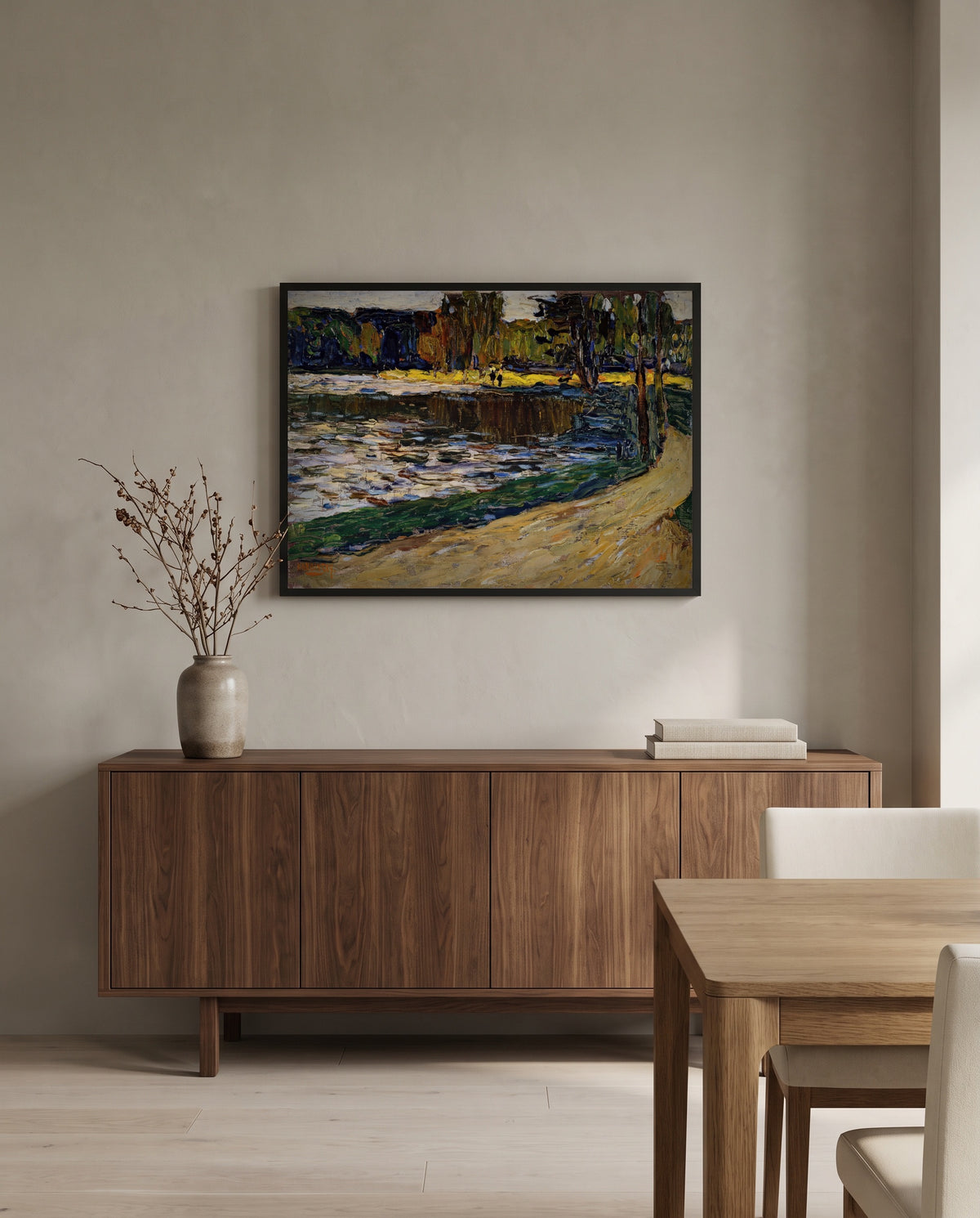Munich – English Garden by Wassily Kandinsky in a black frame above a walnut sideboard in a dining room
