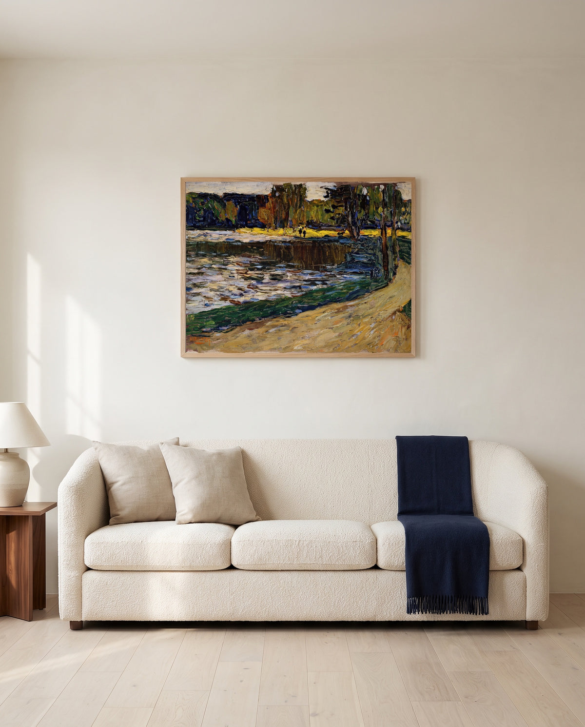 Munich – English Garden by Wassily Kandinsky framed in natural oak above a cream sofa in a warm living room