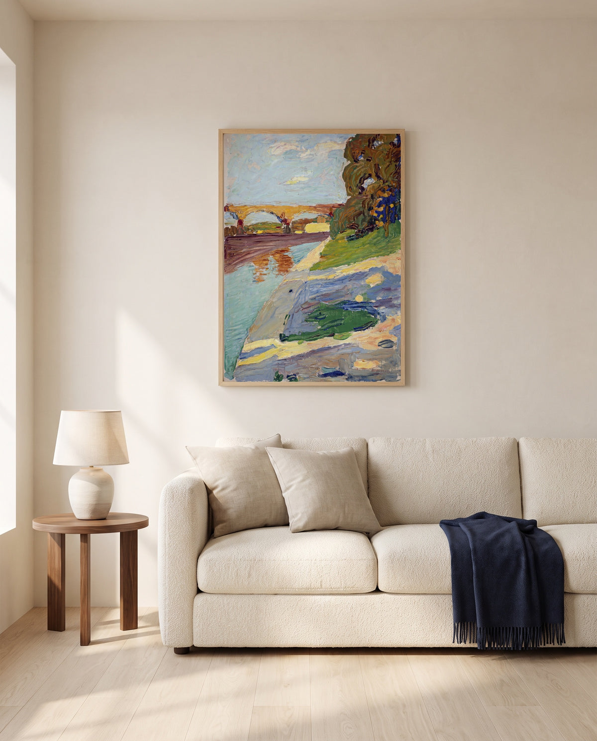 Munich – The Isar by Wassily Kandinsky framed in natural oak above a cream sofa in a warm living room